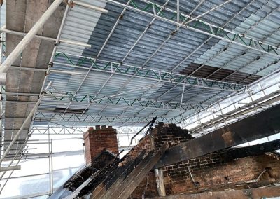 An example of a temporary roof scaffolding project erected over a fire-damaged property.