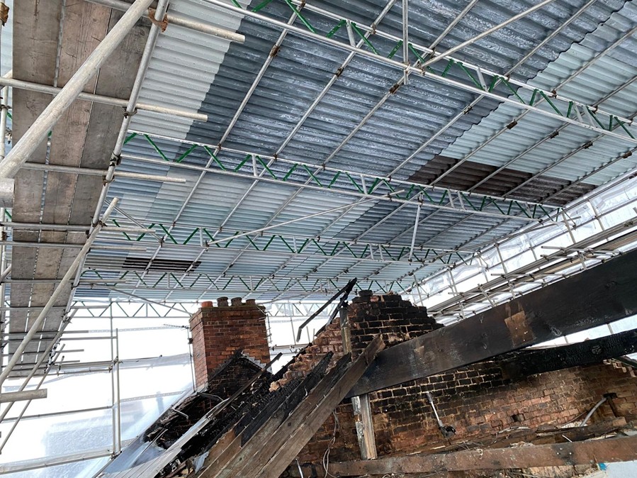 An example of a temporary roof scaffolding project erected over a fire-damaged property.